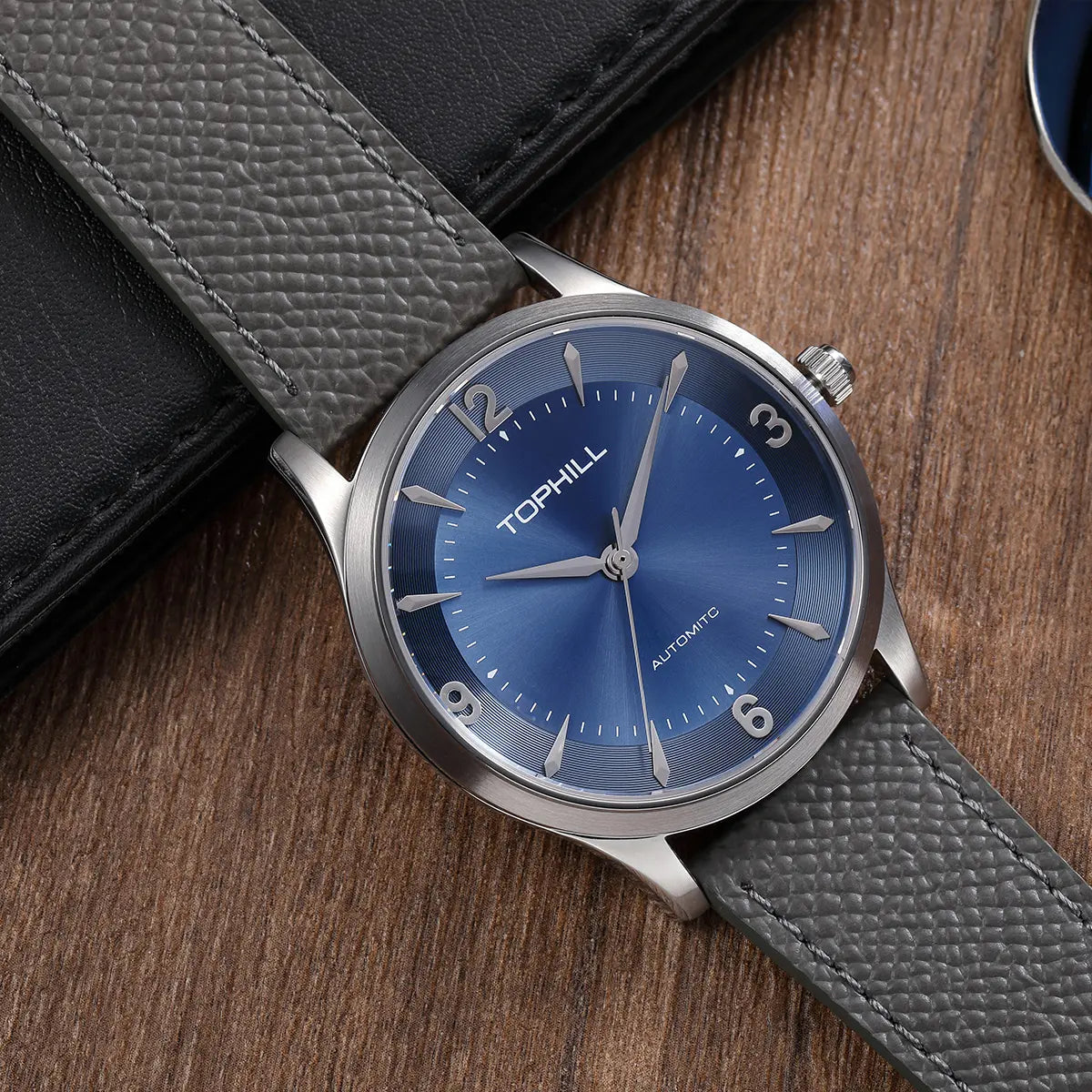 TOPHILL Men's Automatic Mechanical Watch, 42mm 304L Stainless Steel Case, Sunray Dial with Arabic Numerals, Single-Domed Sapphire Crystal, Top Grain Leather Strap, TW111G tophillwatch.com